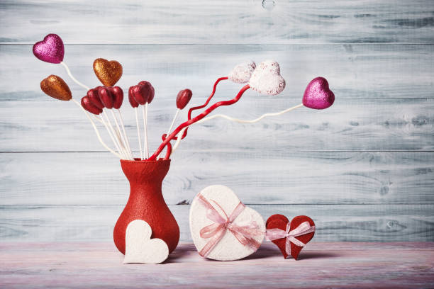 istock Valentines day composition with decorative hearts over wooden background 670796980