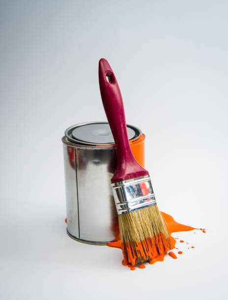 istock Paint tin can with paint brush,orange color 670799360
