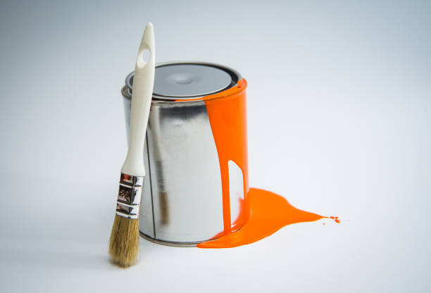 istock Paint tin can with paint brush,orange color 670799460