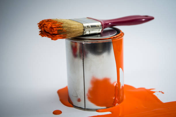 istock Paint tin can with paint brush,orange color 670799770