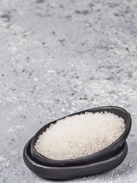 istock background of white sugar on black 670800122