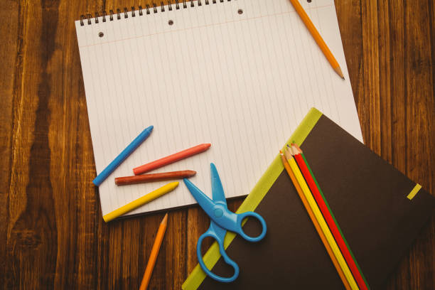 istock School supplies on desk with copy space 670812528