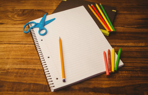 istock School supplies on desk with copy space 670812606