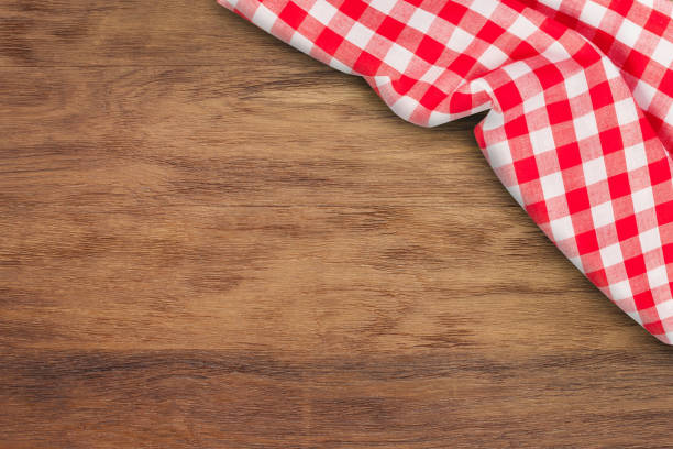 Checkered tablecloth on wooden background. Use for background