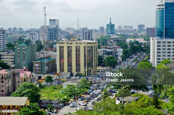 Tuk Tuk Drivers And Other Road Users Travel Around The Port City Of Lagos Stock Photo - Download Image Now