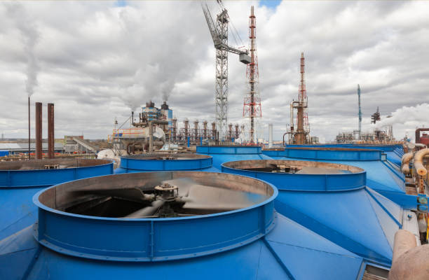 Chemical plant for production of ammonia and nitrogen fertilization Chemical plant for production of ammonia and nitrogen fertilization on day time. Cooling tower with fan blades close-up plant fertilizer stock pictures, royalty-free photos & images