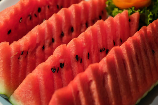 istock Watermelon slice ready to serve. Closeup shot. 670819054