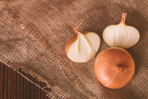 Closeup of onions on a rustic background. Chopped