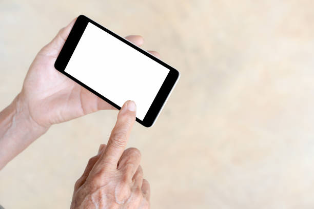 istock older person, hand holding and touch smart phone 670822204