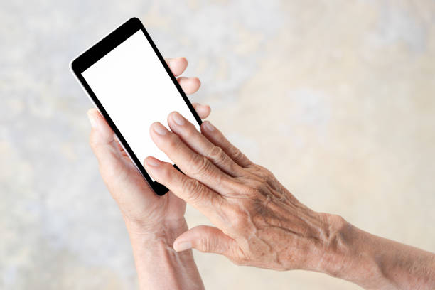 istock older person, hand holding and touch smart phone 670822334