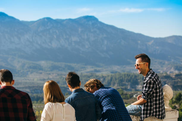 istock Back view of friends outside 670825356