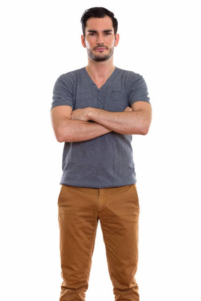 istock Studio shot of young handsome man standing with arms crossed 670835408