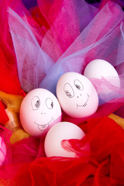 istock Easter eggs with funny faces on colorful and bright background. Emoji funny egg. 670836292