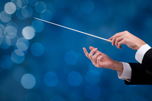 Leadership and manager concepts - orchestra conductor Male orchestra conductor hands with gesture, one with baton. Leadership and manager concepts. musical conductor photos stock pictures, royalty-free photos & images
