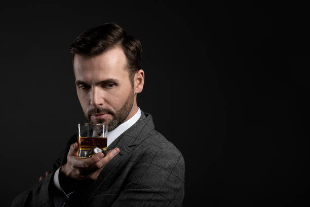 istock Portrait of elegant man drinking whiskey 670848006