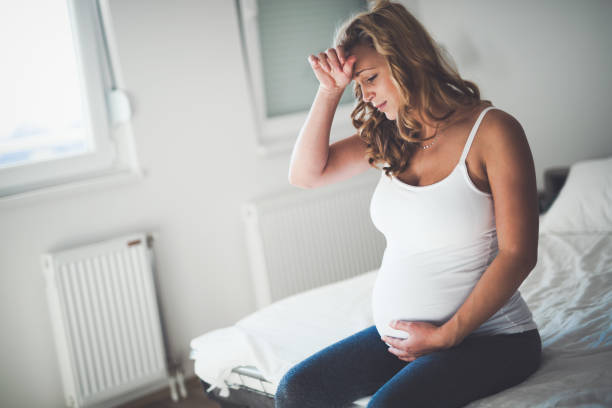 istock Beautiful expectant pregnant woman suffering from nausea 670851348
