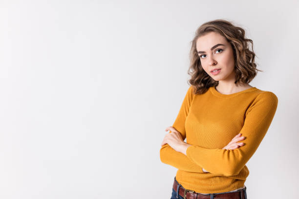 istock Charming girl with arms crossed on a white background. 670857008