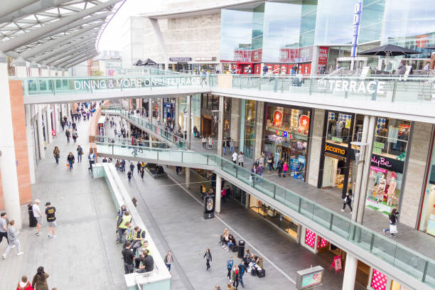 People walking in the Liverpool One shopping centre Liverpool, England - April 3, 2017: People walking in the Liverpool One shopping centre. The place is the largest open air shopping centre in the United Kingdom and the 5th largest overall. liverpool one stock pictures, royalty-free photos & images