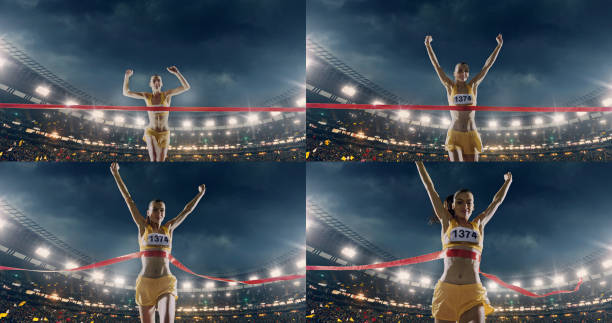 istock Female track and field runner crosses finish line 670858464