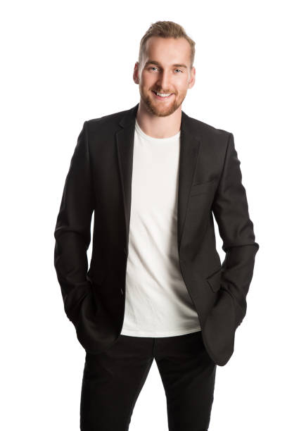Smiling entrepreneur in black blazer Handsome blonde man standing in front of a white background wearing a black blazer. Smiling looking at camera. blazer jacket stock pictures, royalty-free photos & images