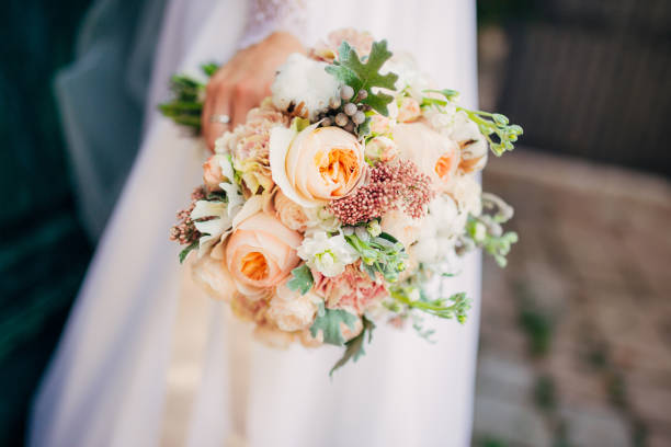 istock Wedding bouquet in hands of the bride 670865986
