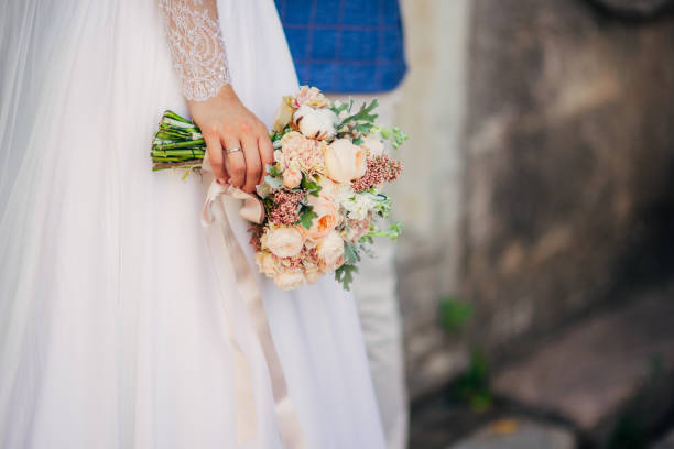 istock Wedding bouquet in hands of the bride 670866144