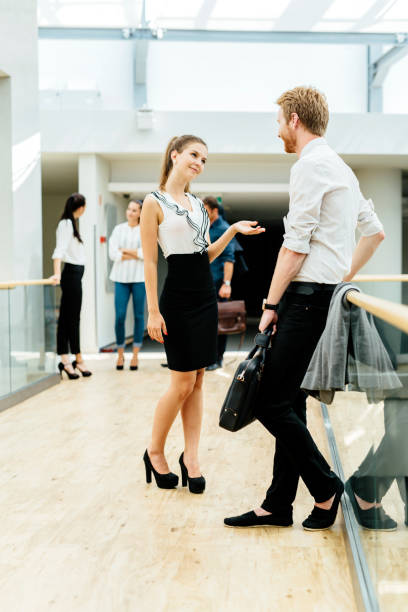 istock Business colleagues talking casually in the building they work in 670870956