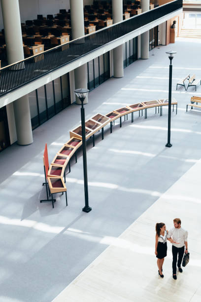 istock Business couple walking together. Top view 670871098