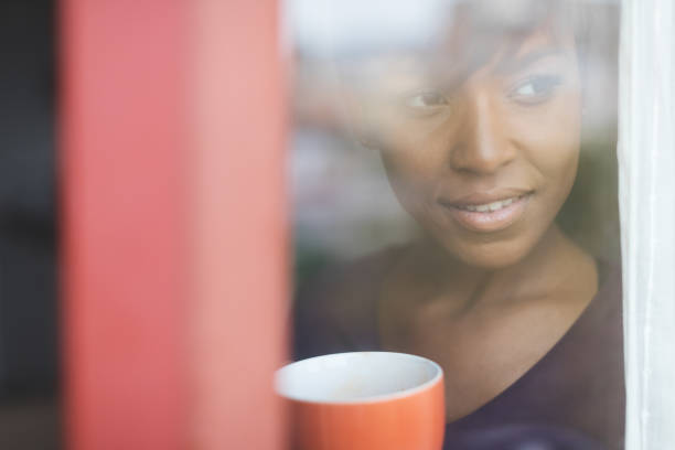 istock Beautiful black woman relaxing at home 670887182