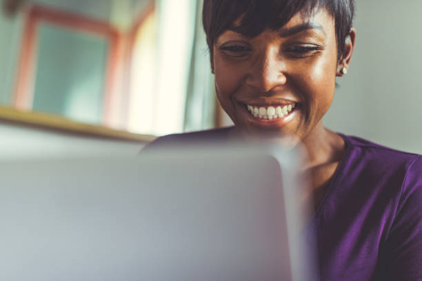 istock Beautiful black woman working at home 670887374
