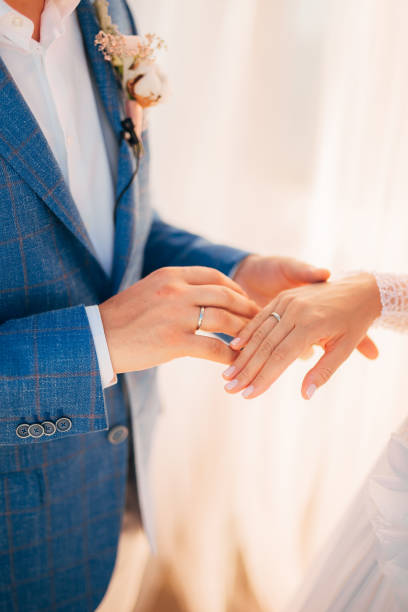 istock The newlyweds exchange rings at a wedding 670888348