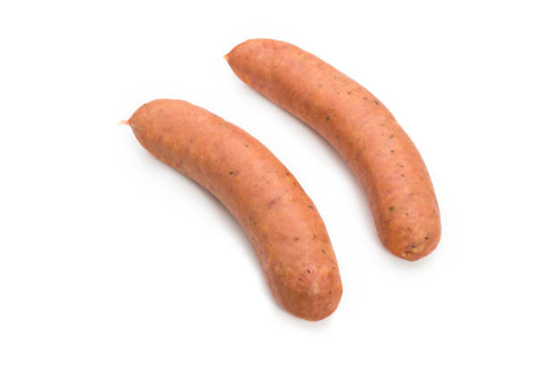 istock Fresh smoked sausages or bratwurst isolated on white background. 670891010