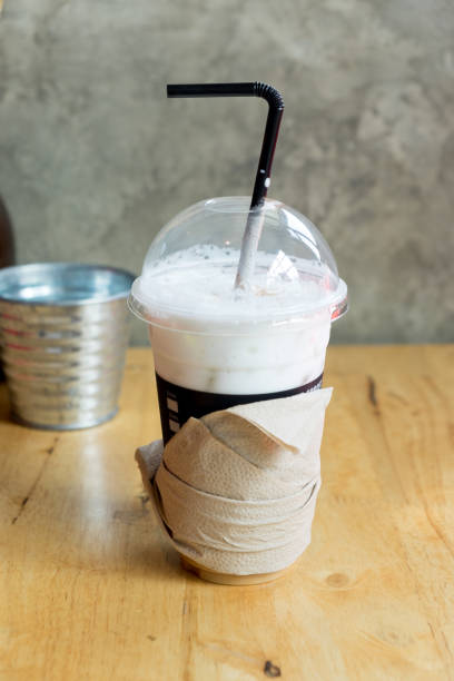 istock Iced coffee latte in takeaway cup on wood table 670891554