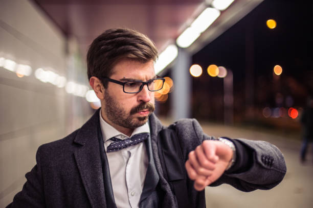 istock Nervous man being late and watching at hand clock 670894882