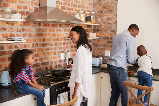 istock Children Helping Parents To Prepare Meal In Kitchen 670901042