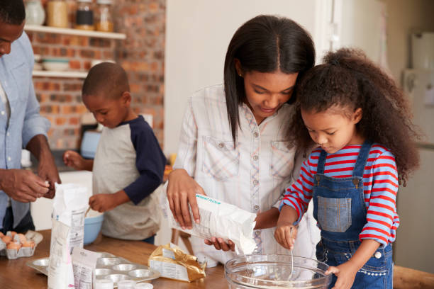 istock Parents And Children Baking Cakes In Kitchen Together 670901044