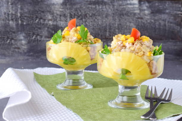 istock Chicken salad with pineapple and walnuts in a glass plate on a dark abstract background. Healthy eating concept. Healthy food 670910072