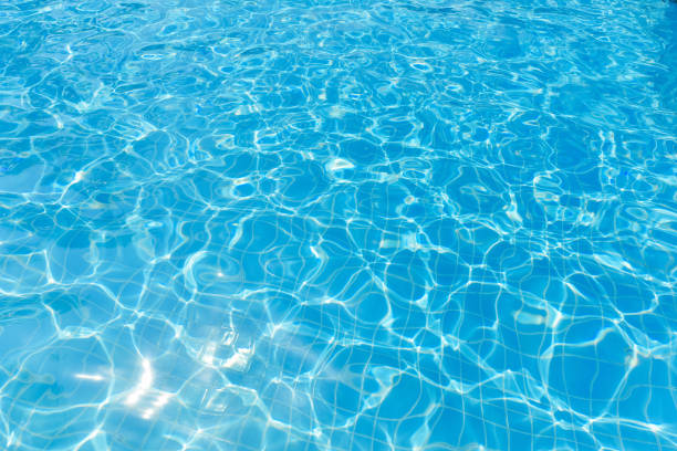 istock Blue and bright ripple water and surface in swimming pool 670910548