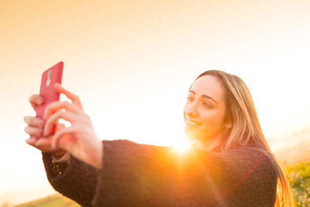 istock Young girl taking selfie in nature 670915156