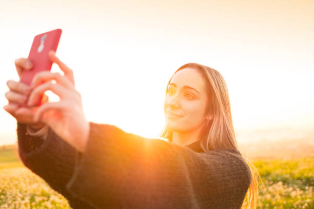 istock Young girl taking selfie in nature 670916956