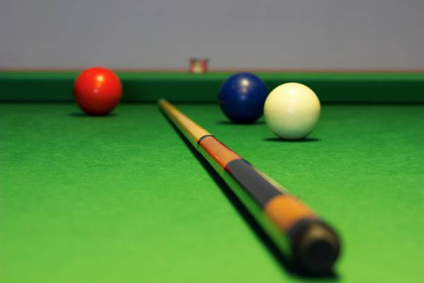 istock biliard balls and cue 670920326
