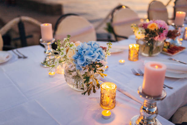 istock Flower compositions on the wedding table in rustic style. Wedding decorations with their own hands 670921344