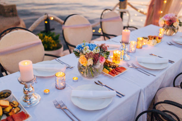 istock Flower compositions on the wedding table in rustic style. Wedding decorations with their own hands 670923702