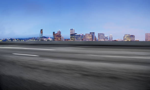 istock empty road with cityscaep of modern city 670923954