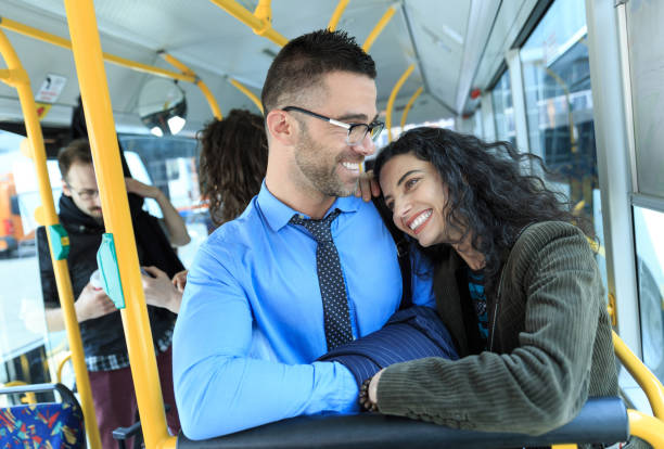 istock Smiling young couple traveling in a bus 670923972