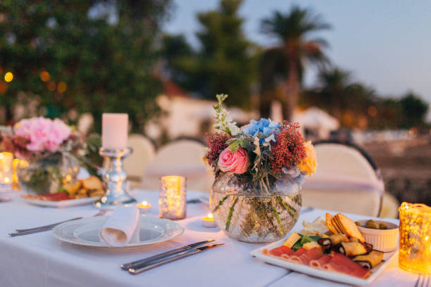 Flower compositions on the wedding table in rustic style. Wedding decorations with their own hands