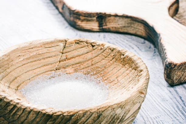 istock Sugar in wooden bowl 670924162