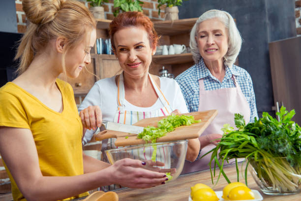istock Family cooking together in kitchen 670924430