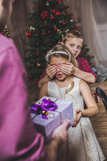 istock Girl receiving present 670924506