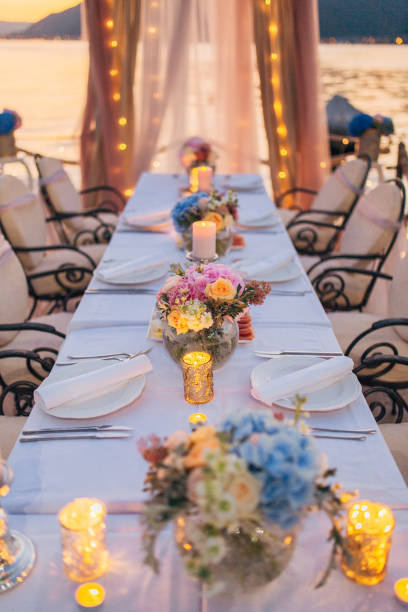 istock Flower compositions on the wedding table in rustic style. Wedding decorations with their own hands 670925008